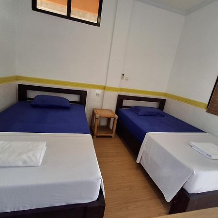 Dharma Homestay ปาดังไบ ภายนอก รูปภาพ